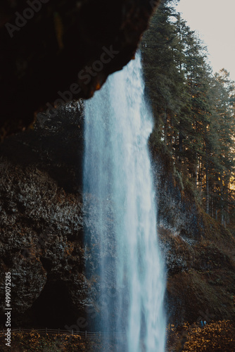 behind a waterfall