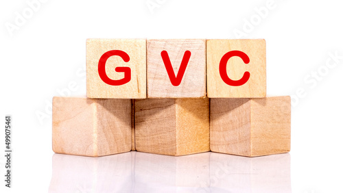 GVC text on wooden cubes on a white background photo