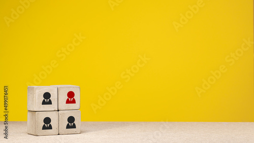 Employee red icon, silhouette on concrete cube, different thinking and human development concept.