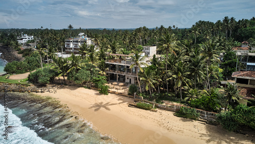 Aerial view of coastline and modern hotel in Sri Lanka