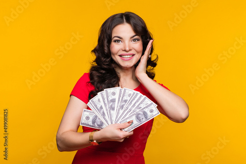 Businesswoman showing fan dollars