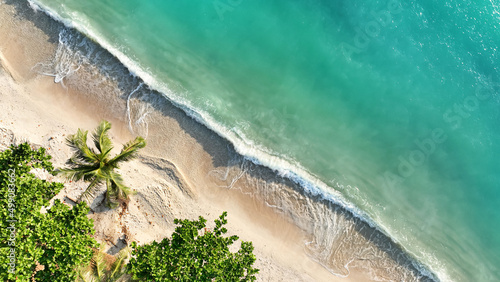 Aerial top view  in a tropical summer with  Soft blue ocean wave on the beach and soft wave background.