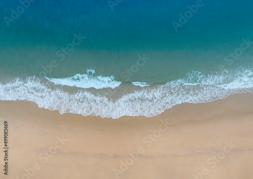 Aerial view with the tropical summer beach and water wave on the beach,top view image background © SASITHORN