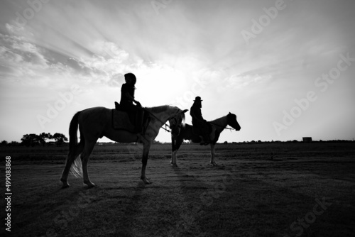 Children riding horse at sunset © khamkula