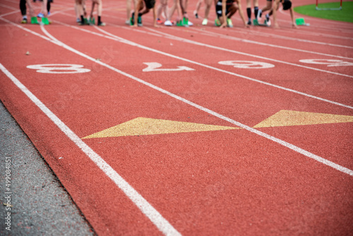Runners on the starting blocks on an athletic racing track