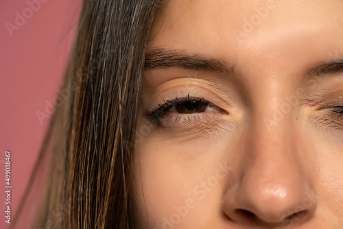 Cropped image of a woman with a half-closed eye