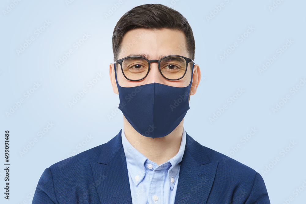 Young successful man in blue mask