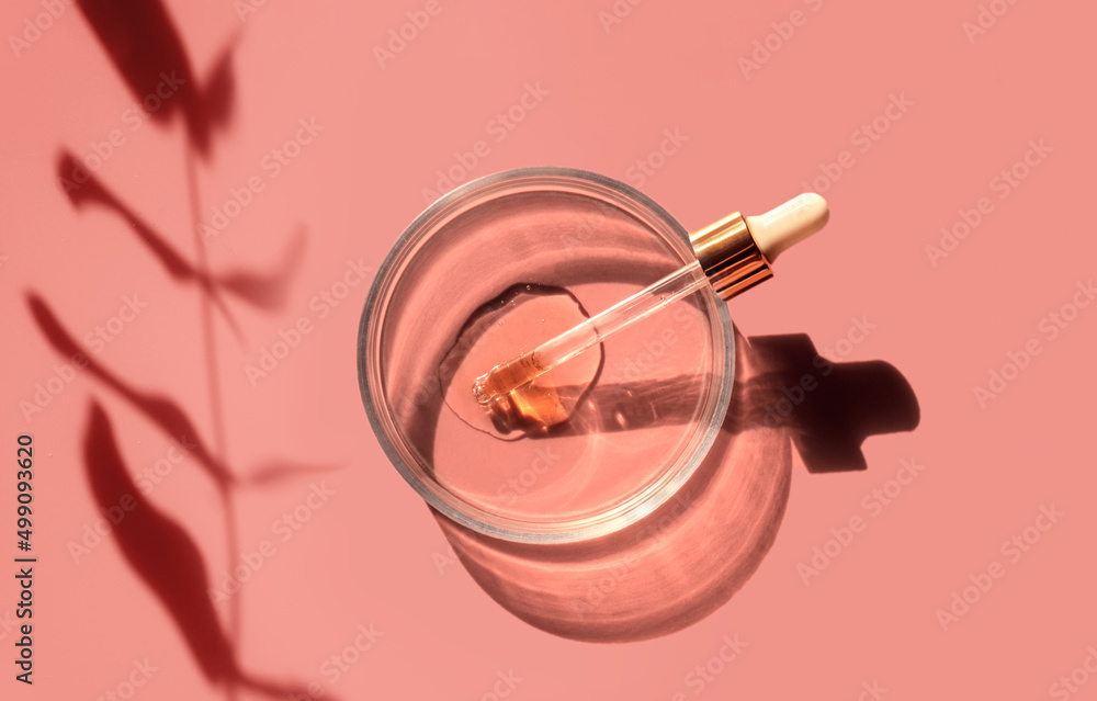 Laboratory glass petri dish with pipette and drop of water, serum, oil, beauty product. Natural medicine, cosmetic research, bio science. Skincare and analysis concept. Dermatology. Flat lay, top view Laboratory glass petri dish with pipette and drop of water, serum, oil, beauty product. Natural medicine, cosmetic research, bio science. Skincare and analysis concept. Dermatology. Flat lay, top view