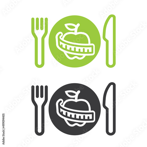 World obesity day. Fork, knife and plate containing diet food. Symbol for diet.