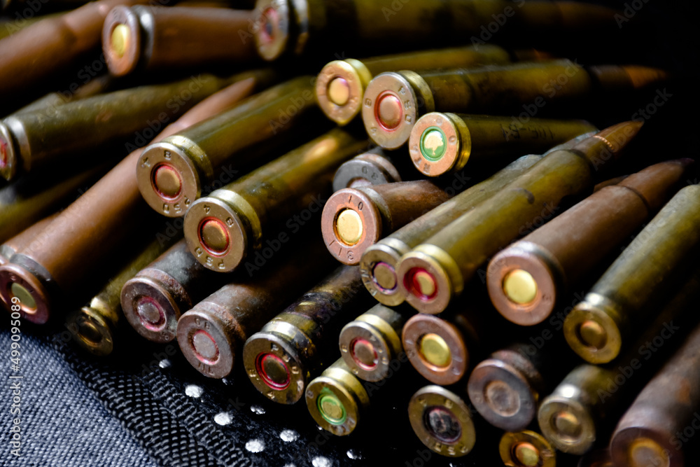 Closeup view of the old bullet butts on dark background, soft and selective focus on bullet butts. Closeup view of the old bullet butts on dark background, soft and selective focus on bullet butts.