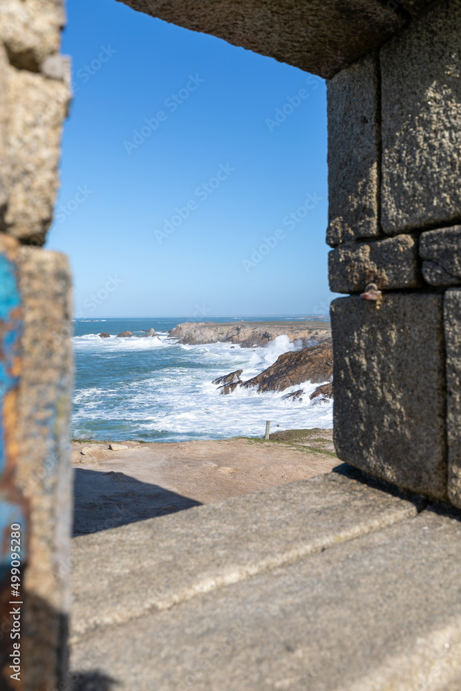 Seascape thru the stone wall in Quiberon in France on march 2022