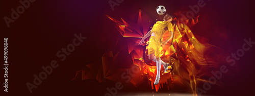 Creative artwork with soccer, football player in motion and action with ball isolated on dark background with polygonal and fluid neon elements. Art, creativity, sport