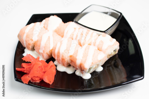 rolls, black plate, white background