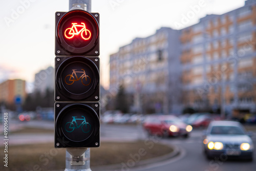 Traffic red light forbids bicycles to pass in public place. 