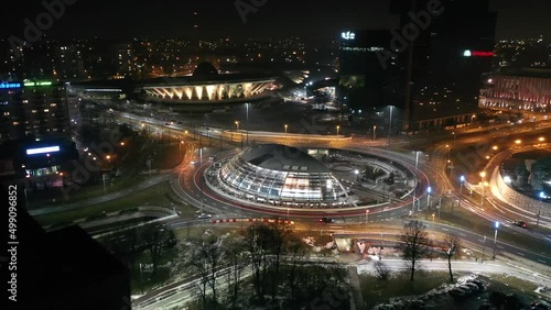 Aerial view of the center of Katowice, The roundabout Generała Ziętka and Superjednostka apartment building in foreground - Day to night transition. Silesia, Poland photo