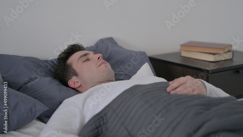 Man Sleeping in Bed Peacefully