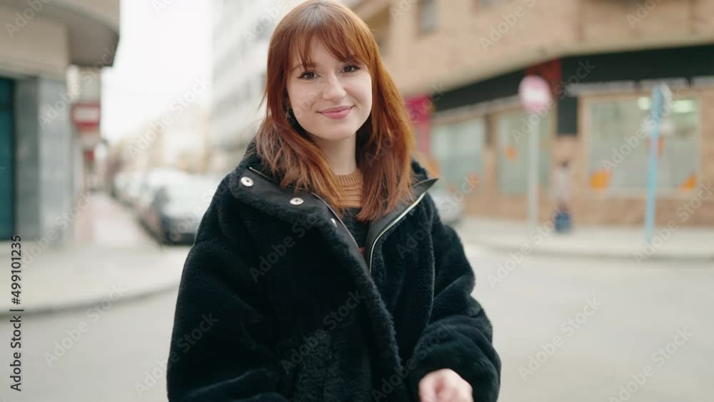 Young woman smiling confident standing with arms crossed gesture at street Young woman smiling confident standing with arms crossed gesture at street
