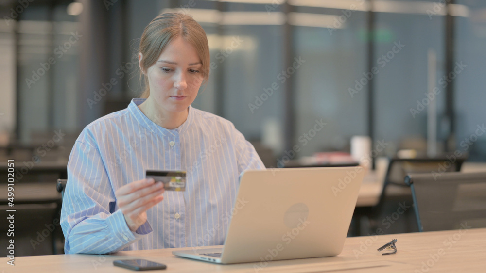 Young Woman Shopping Online on Laptop Young Woman Shopping Online on Laptop