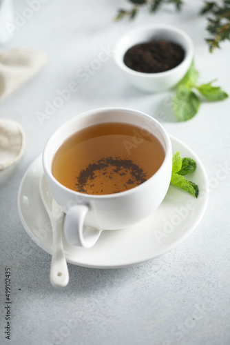 Healthy homemade mint tea in a white cup