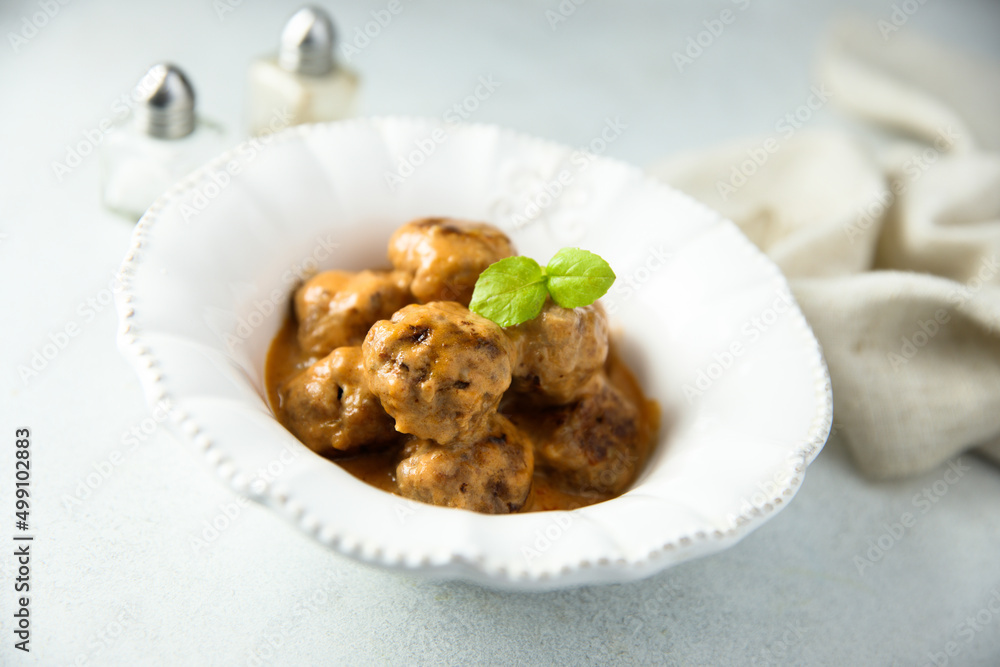 Homemade meatballs in a white bowl Homemade meatballs in a white bowl