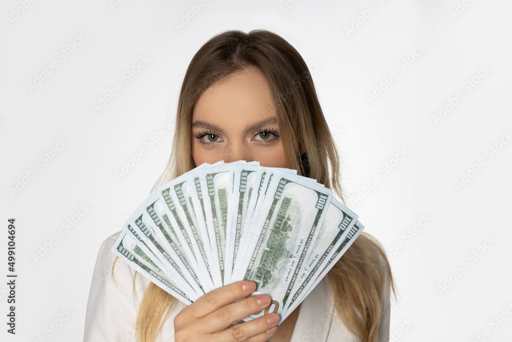 frightened look from behind dollar banknotes in hands frightened look from behind dollar banknotes in hands
