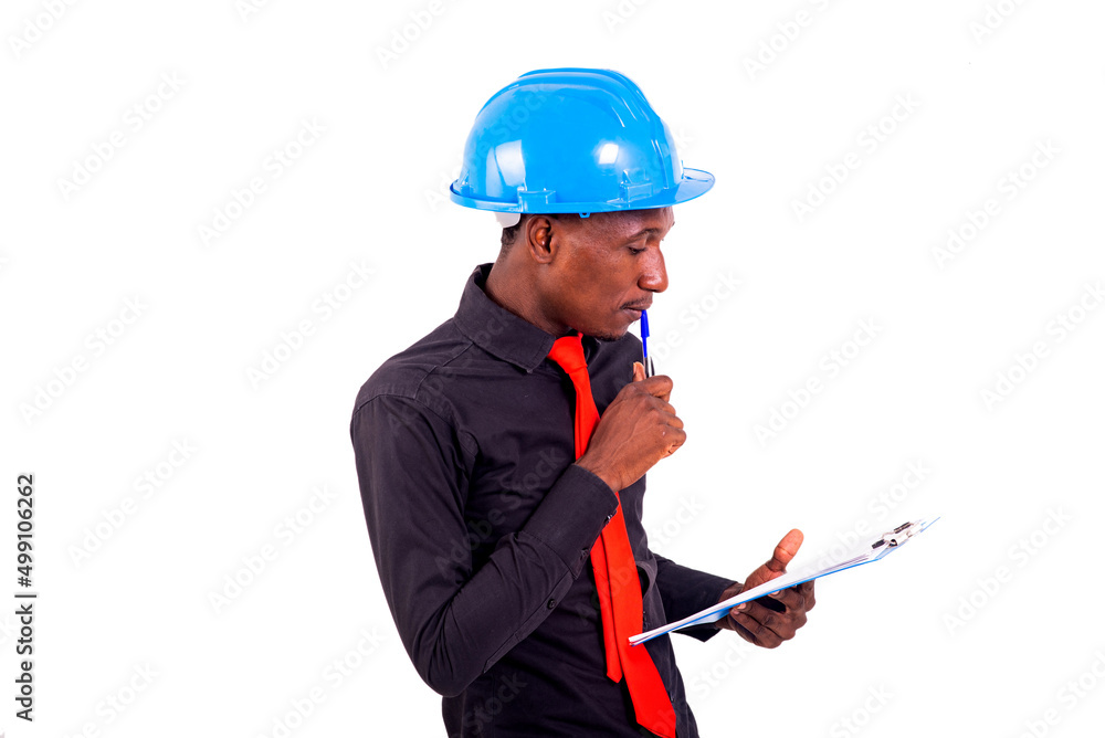 young man engineer reading document note on clipboard. young man engineer reading document note on clipboard.