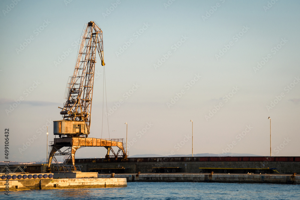  Cranes in the ship's port as silhouettes, in Rijeka in Croatia