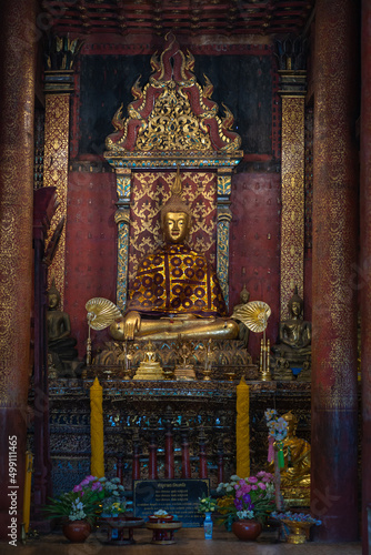 Ancient Buddha of Wat Ton Kain temple is the old wooden temple a famous place religious travel destination in Chiang Mai, Thailand. © pomphotothailand