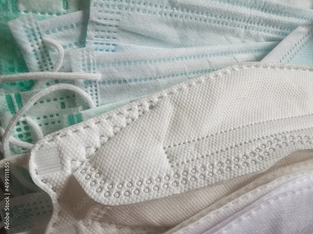 pile of KN95, KF94 masks and medical masks. Covid19 prevention concept Stock Photo Adobe Stock