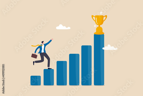 Motivation to drive success, achievement or reward motivate employee to improve and succeed, benefit, prize award concept, motivated businessman running on growing bar graph to catch winner trophy.