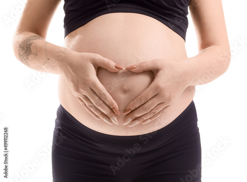 Pregnant woman making heart...