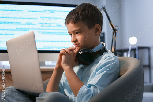 Cute little programmer usin...