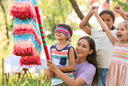 Woman and cute children at ...