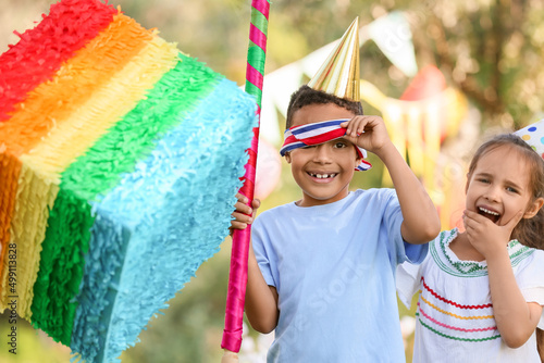 Cute children at pinata bir...