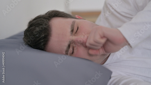 Man Coughing while Sleeping in Bed, Close up