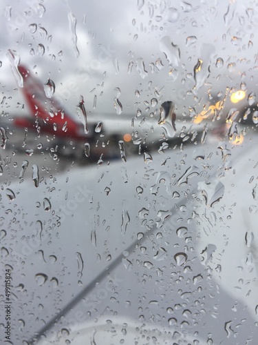Rain causes delays and aircraft are prevented from taking off during bad weather in the airport.