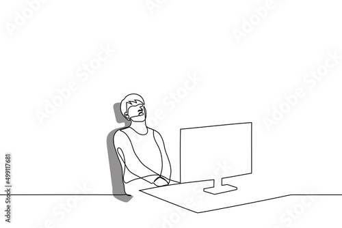 man fell asleep sitting at his desk in front of a computer monitor - one line drawing vector. workplace overwork concept, lazy unprofessional worker, freelancer took a break, daytime nap sitting