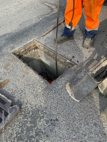 Cleaning storm drains from debris, clogged drainage systems are cleaned with a pump and water