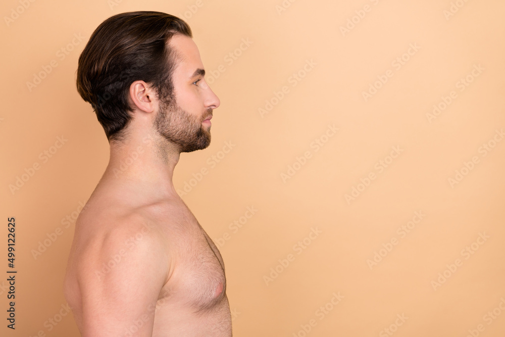 Fototapeta premium Profile photo of calm confident person look empty space blank isolated on beige color background