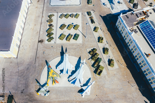 Top view of the military base. Tanks, self-propelled howitzers, rocket launchers, helicopters and aircraft
