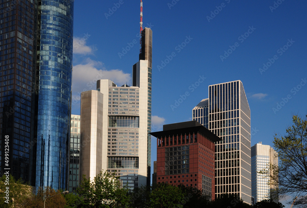 Fototapeta premium View From Taunusanlage To The Skyscraper In The Financial District In Frankfurt Hesse Germany On A Beautiful Spring Day With A Clear Blue Sky And A Few Clouds