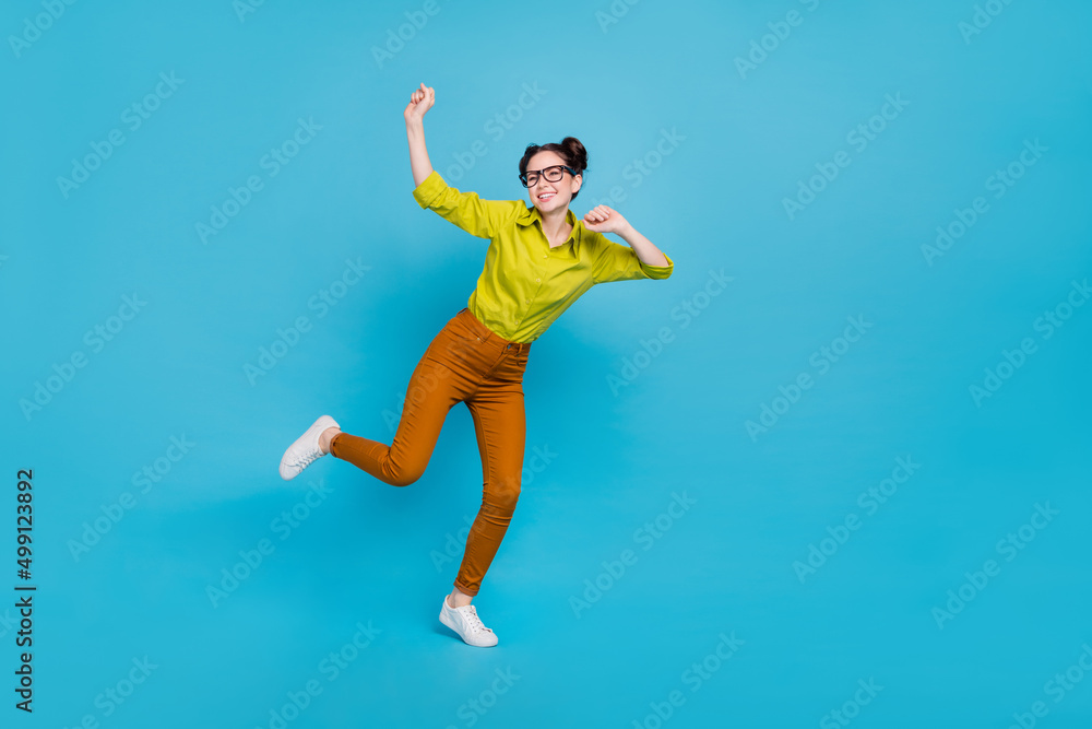 Full length portrait of satisfied glad person enjoy free time clubbing isolated on blue color background