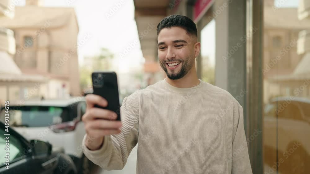 Young arab man smiling confident having video call at street Young arab man smiling confident having video call at street