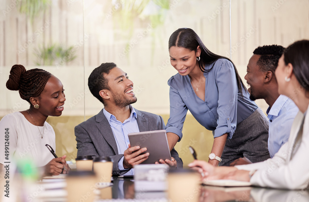 Explore business ideas freely. Shot of a group of coworkers using a digital tablet during a business meeting. Explore business ideas freely. Shot of a group of coworkers using a digital tablet during a business meeting.