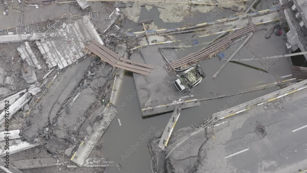 Abandoned cars near the destroyed bridge across the Irpin River. War in Ukraine. City of Irpin. Abandoned cars near the destroyed bridge across the Irpin River. War in Ukraine. City of Irpin.