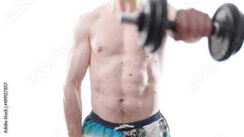 Headless man on white background doing dumbbell shoulder front raise exercise