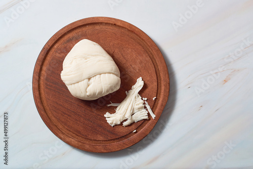 Traditional oaxaca cheese ball or quesillo. Mexican food.