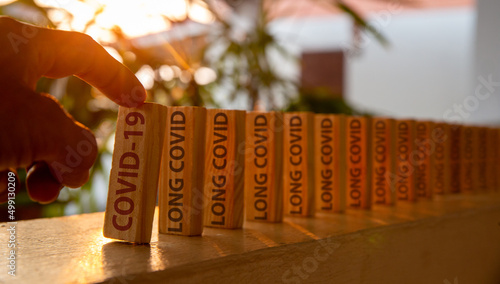 Hand poked on a row of wooden dominoes, with the words 