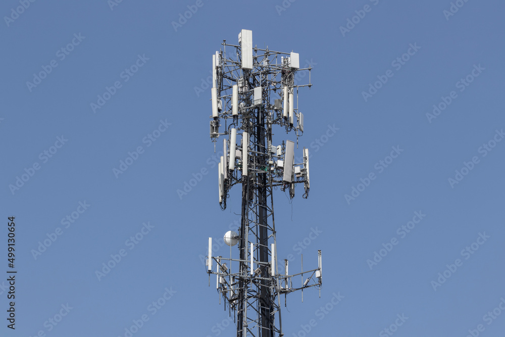Telecommunications and wireless cell equipment tower with directional mobile phone antenna. Telecommunications and wireless cell equipment tower with directional mobile phone antenna.