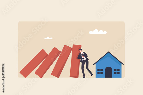 Housing crisis, a real estate marketplace for distressed properties..The slowdown in real estate prices. Businessman stops a domino effect to protect a house.